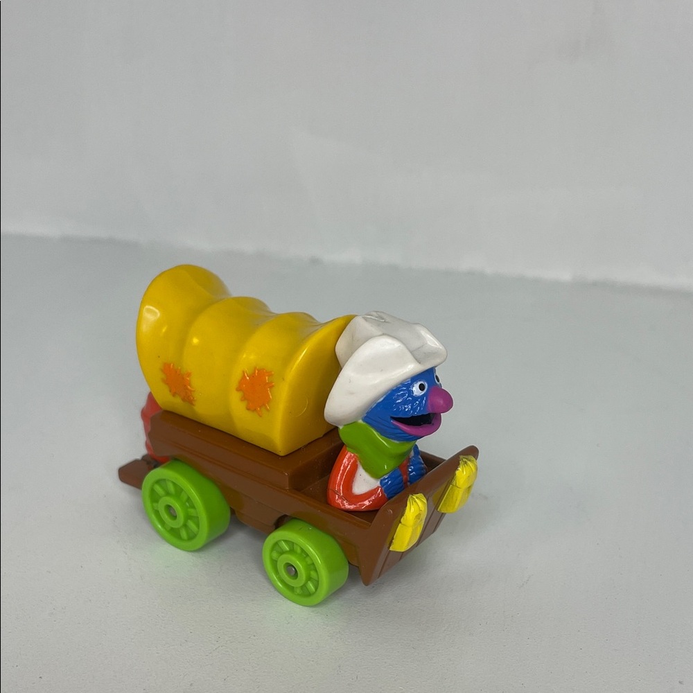 vintage 1987 Sesame Street Grover covered wagon die-cast toy car by Playskool.